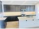 Modern kitchen features dark wood cabinets, a large island, subway tile backsplash and stainless steel appliances at 3804 S Buttercup --, Mesa, AZ 85212