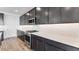 Modern kitchen featuring stainless steel appliances, dark cabinets, and white subway tile backsplash at 3804 S Buttercup --, Mesa, AZ 85212