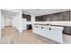 Spacious kitchen with a large island, stainless steel appliances, and wood-style floors at 3804 S Buttercup --, Mesa, AZ 85212