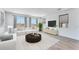 Bright living room showcasing modern furnishings, large windows, and neutral tones for a welcoming atmosphere at 3804 S Buttercup --, Mesa, AZ 85212