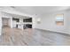 Open-concept living area with a kitchen featuring dark cabinets and stainless steel appliances at 3804 S Buttercup --, Mesa, AZ 85212