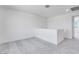 Loft area with gray carpet and white walls leading to other rooms at 3804 S Buttercup --, Mesa, AZ 85212
