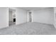 Spacious main bedroom featuring plush carpeting with an ensuite bathroom and walk-in closet at 3804 S Buttercup --, Mesa, AZ 85212