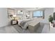 Comfortable primary bedroom with serene decor, a large window, and stylish bedside tables and lamps at 3804 S Buttercup --, Mesa, AZ 85212
