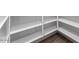 Walk-in pantry with white shelving and wood-style flooring providing ample storage space at 3804 S Buttercup --, Mesa, AZ 85212
