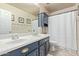 Classic bathroom featuring double sinks and a cabinet with a shower/tub at 4446 W Hower Rd, Phoenix, AZ 85086