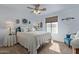 Bright bedroom featuring a bed, carpet floors, and a window with outdoor views at 4446 W Hower Rd, Phoenix, AZ 85086