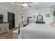 Comfortable bedroom with wood-look floors, neutral accents, and stylish decor at 4446 W Hower Rd, Phoenix, AZ 85086