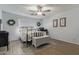 Stylish bedroom with wood floors, neutral walls, and a vintage-style rug at 4446 W Hower Rd, Phoenix, AZ 85086