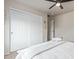 Cozy bedroom featuring a comfortable bed, carpet floors, ceiling fan and closet at 4446 W Hower Rd, Phoenix, AZ 85086