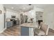 Open kitchen with a breakfast bar, stainless steel appliances, and light granite countertops at 4446 W Hower Rd, Phoenix, AZ 85086