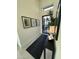 Modern entryway features a black console table, rug, and framed art at 20475 E Indiana Ave, Queen Creek, AZ 85142