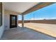 A covered back porch looks out to the large yard at 25238 N 172Nd Ln, Surprise, AZ 85378