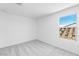 Bright bedroom with neutral carpet and view out of window at 25238 N 172Nd Ln, Surprise, AZ 85378