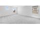 Spacious bedroom with plush carpet and lots of natural light from two windows at 25238 N 172Nd Ln, Surprise, AZ 85378
