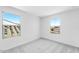 Bright bedroom with plush carpet and dual window views at 25238 N 172Nd Ln, Surprise, AZ 85378