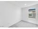 Bright bedroom with neutral carpet and window overlooking the neighborhood at 25238 N 172Nd Ln, Surprise, AZ 85378