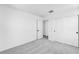 Bright bedroom with neutral carpet, white walls, closet, and door to additional room at 25238 N 172Nd Ln, Surprise, AZ 85378