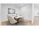 Cozy dining room featuring a marble-top table and modern art at 25238 N 172Nd Ln, Surprise, AZ 85378