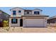 Charming two-story home with a two car garage and beautifully tiled roof at 25238 N 172Nd Ln, Surprise, AZ 85378