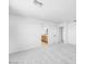 Hallway leading to bathroom with vanity, sink, and mirror, and the bedroom at 25238 N 172Nd Ln, Surprise, AZ 85378