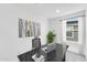 Bright home office with large desk, house plant, and window at 25238 N 172Nd Ln, Surprise, AZ 85378