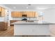 Open kitchen with a large island, modern countertops, and stainless steel appliances at 25238 N 172Nd Ln, Surprise, AZ 85378