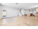 Bright, open-concept living room featuring hardwood floors and staircase access at 25238 N 172Nd Ln, Surprise, AZ 85378