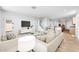 Bright, open-concept living room with modern decor, tile floors, and lots of light at 25238 N 172Nd Ln, Surprise, AZ 85378