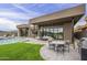 Modern backyard with a swimming pool, patio furniture, and golf course views at 37200 N Cave Creek Rd # 1023, Scottsdale, AZ 85262