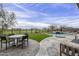 Backyard featuring a pool, spa, outdoor seating, and views of the golf course at 37200 N Cave Creek Rd # 1023, Scottsdale, AZ 85262