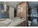 Modern bathroom with sleek vanity, stylish mirror, and glass-enclosed shower at 37200 N Cave Creek Rd # 1023, Scottsdale, AZ 85262