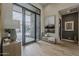 Welcoming foyer with hardwood floors, contemporary decor, and an open view to the outdoor patio, blending indoor-outdoor living at 37200 N Cave Creek Rd # 1023, Scottsdale, AZ 85262
