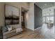 Elegant foyer with hardwood floors, modern artwork, and an open floor plan, welcoming guests into a stylish home at 37200 N Cave Creek Rd # 1023, Scottsdale, AZ 85262