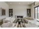 Spacious living room with a stone fireplace, built-in bookshelves, and comfortable seating, ideal for relaxation and entertainment at 37200 N Cave Creek Rd # 1023, Scottsdale, AZ 85262
