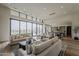 Spacious living room with large windows, neutral tones, and seamless transition to outdoor living areas at 37200 N Cave Creek Rd # 1023, Scottsdale, AZ 85262
