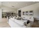 Open-concept living area with modern furnishings, wood flooring, and seamless flow to kitchen at 37200 N Cave Creek Rd # 1023, Scottsdale, AZ 85262