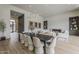 Open-concept living area connecting dining, and living spaces with modern finishes and decor at 37200 N Cave Creek Rd # 1023, Scottsdale, AZ 85262