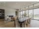 Open living space with a fireplace, dining area, and access to the outdoor with inviting decor at 37200 N Cave Creek Rd # 1023, Scottsdale, AZ 85262