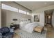Comfortable main bedroom featuring stylish decor, hardwood floors, and an abundance of natural light from the window at 37200 N Cave Creek Rd # 1023, Scottsdale, AZ 85262