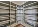 Walk-in pantry featuring gray shelving and ample storage space at 37200 N Cave Creek Rd # 1023, Scottsdale, AZ 85262