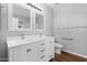 Bathroom with double sinks, modern vanity, and sleek fixtures for a luxurious feel at 44032 W Garden Ln, Maricopa, AZ 85139
