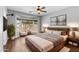 Comfortable main bedroom featuring a bay window and a ceiling fan for a cozy atmosphere at 44032 W Garden Ln, Maricopa, AZ 85139