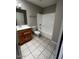 Cozy bathroom featuring a vanity, toilet, and a shower-tub combination at 1302 W Estrella Dr, Chandler, AZ 85224
