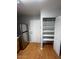 Kitchen with stainless steel refrigerator, pantry, and white door at 1302 W Estrella Dr, Chandler, AZ 85224