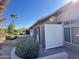 Backyard with privacy wall, landscaping, and a view of a palm tree at 13706 W Caballero Dr, Sun City West, AZ 85375