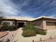 Charming single-story home with a tile roof, desert landscaping, and an attached garage at 13706 W Caballero Dr, Sun City West, AZ 85375