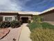 Beautiful single-story home featuring a tiled roof and desert landscaping at 13706 W Caballero Dr, Sun City West, AZ 85375