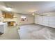 Large garage with ample storage, built-in cabinets and desk, laundry hookups, and a garage door at 13706 W Caballero Dr, Sun City West, AZ 85375