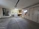 Spacious garage with plenty of storage cabinets, laundry area, and utility sink at 13706 W Caballero Dr, Sun City West, AZ 85375